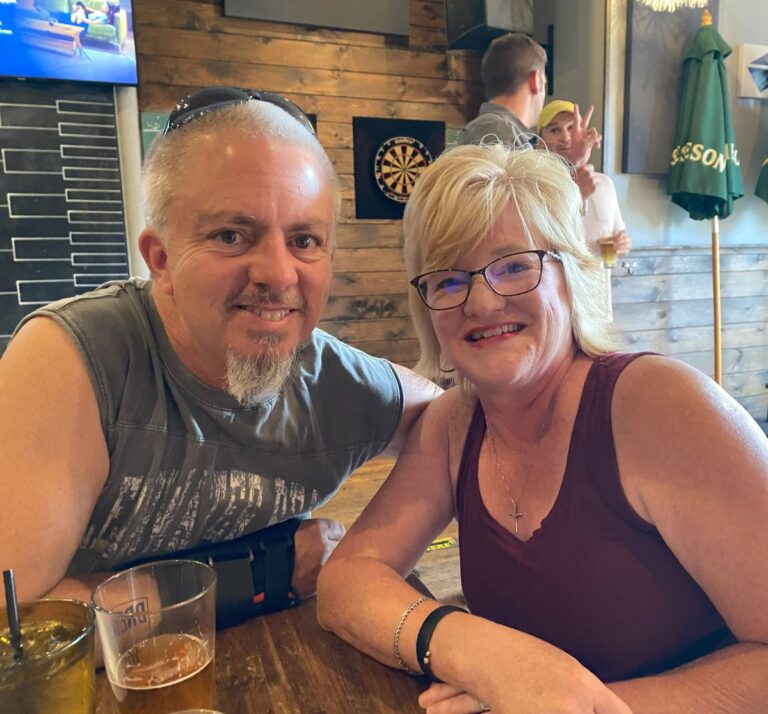 husband and wife sitting at table